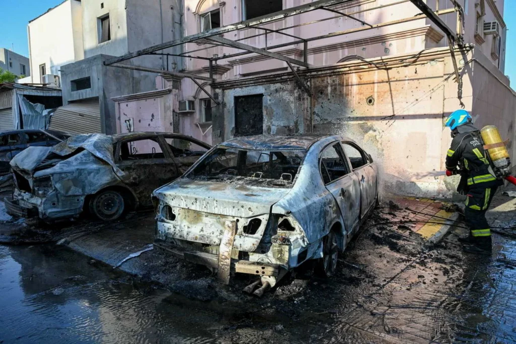 A firefighter works in the aftermath of Iranian drone attacks, according to Bahrain's Interior Ministry, at a location given as Bahrain, in this handout image released on June 11, 2026. Ministry of Interior of the Kingdom of Bahrain/Handout via REUTERS